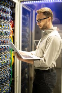 Programmer examining server